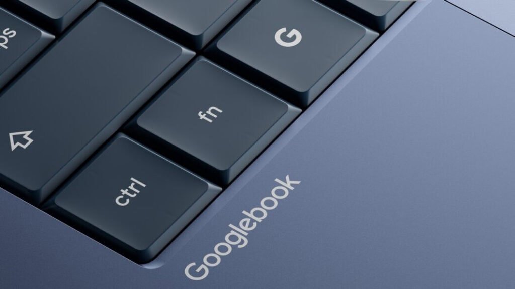 Detalhe do teclado e do chassi do Googlebook, com a marcação do nome do dispositivo gravada próximo às teclas de função e controle.